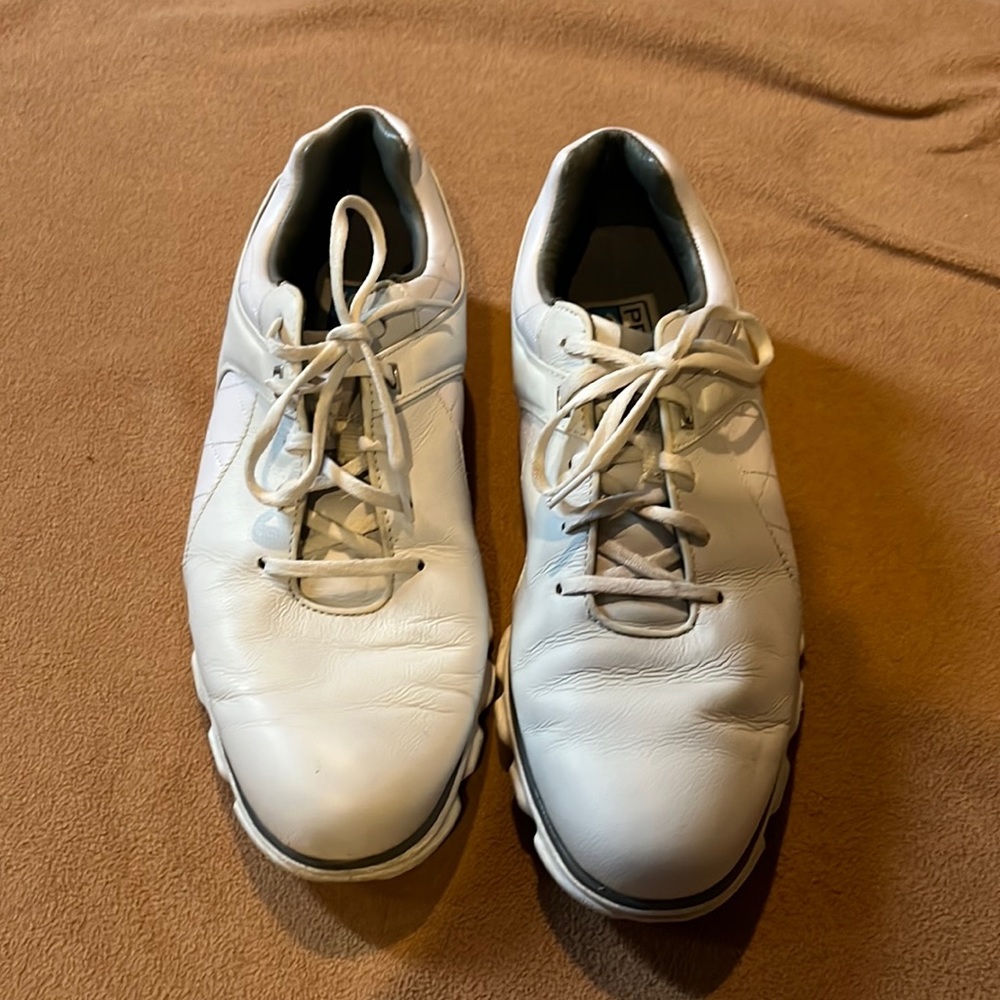 White previously owned shoes